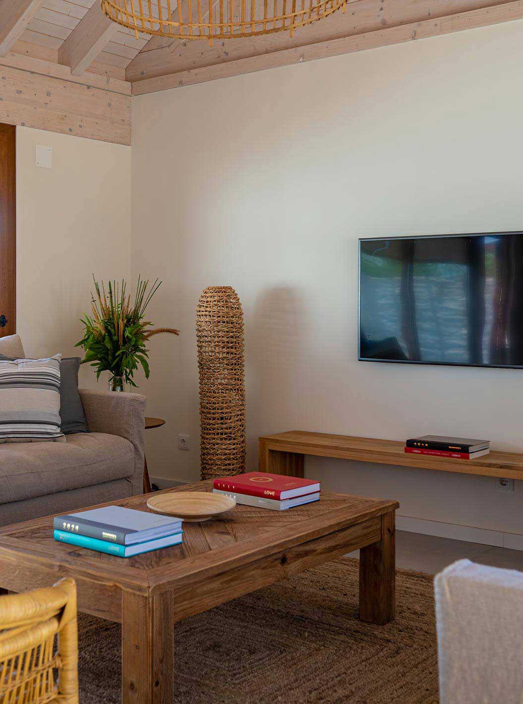 The Standard Villa at Pestana Comporta Village Residences has a living room with a sofa and a TV on the wall