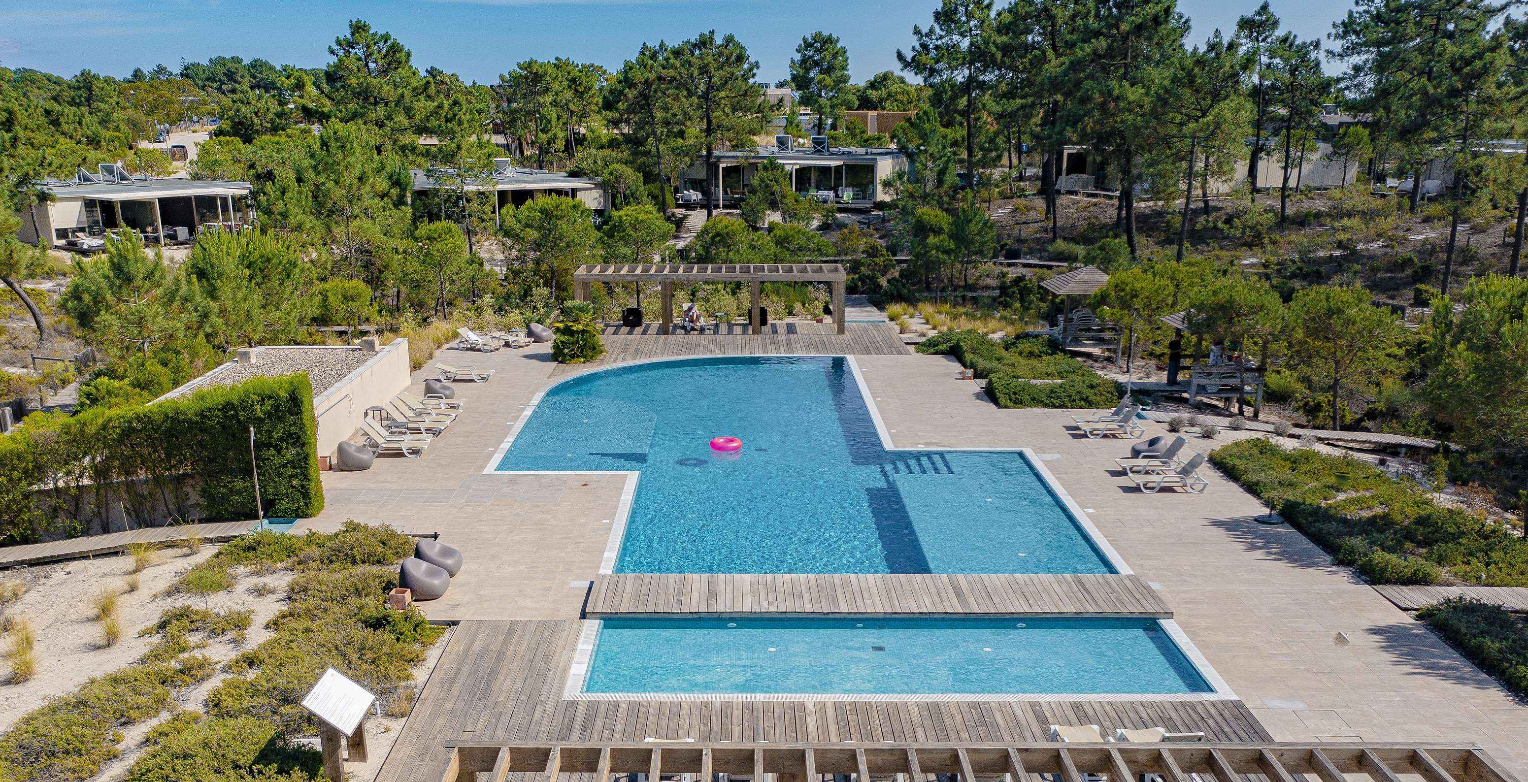 Aerial view of one of the outdoor pools at Pestana Tróia Eco Resort, a resort near Comporta