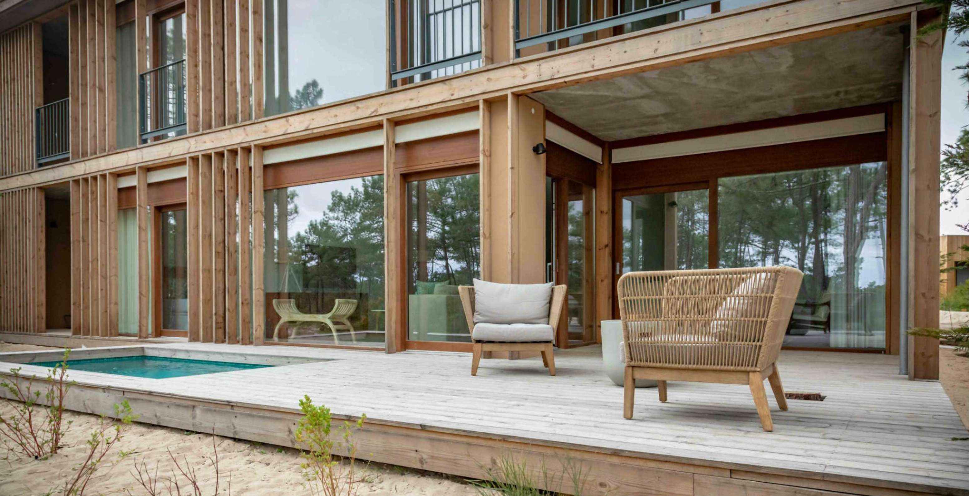 The Eco Village Apartment Ground Floor Views of Pestana Tróia Eco Resort has a deck with pool and two chairs