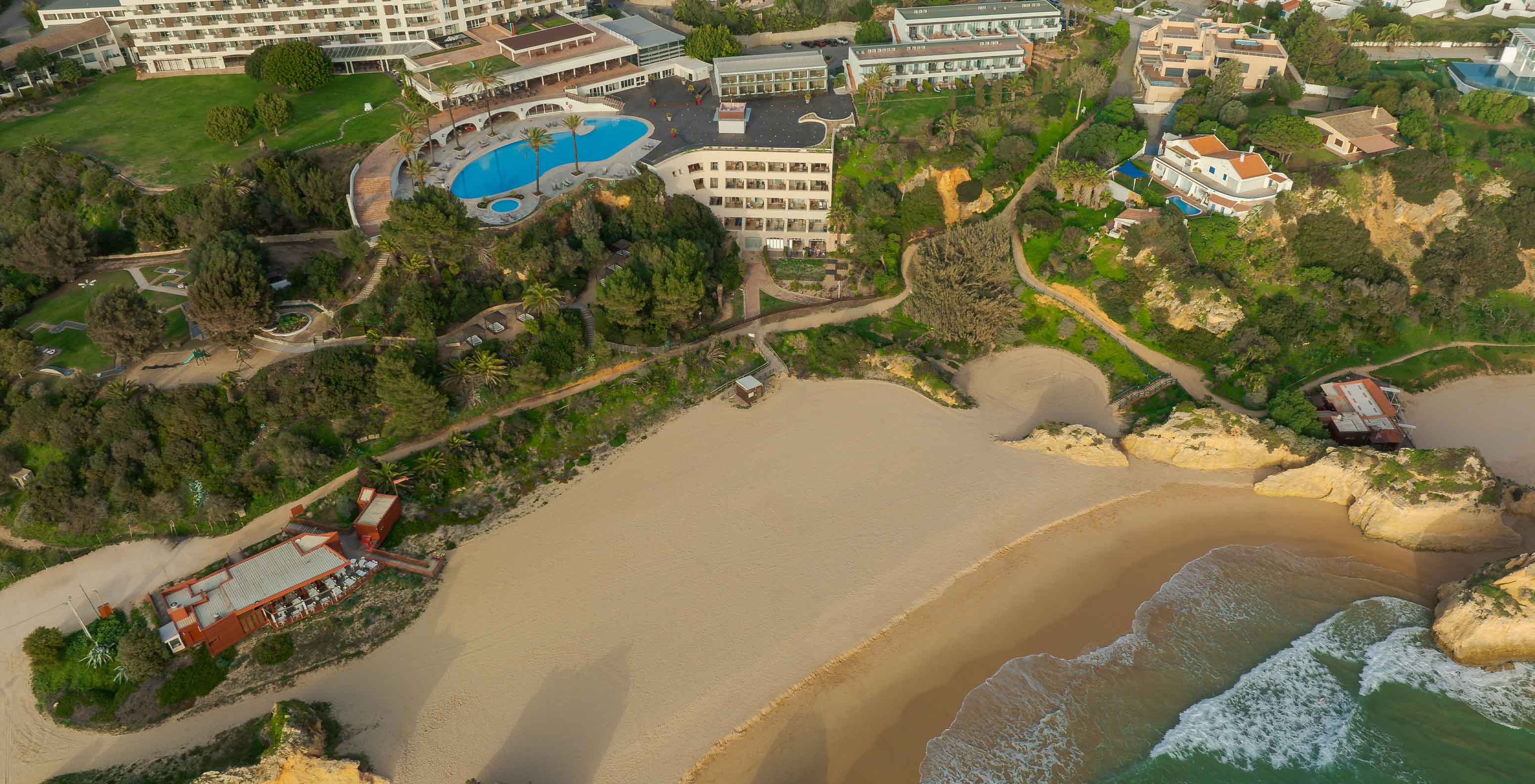 Aerial view of Pestana Alvor Praia hotel with Três Irmãos Beach in front with the rocks, sand and the ocean