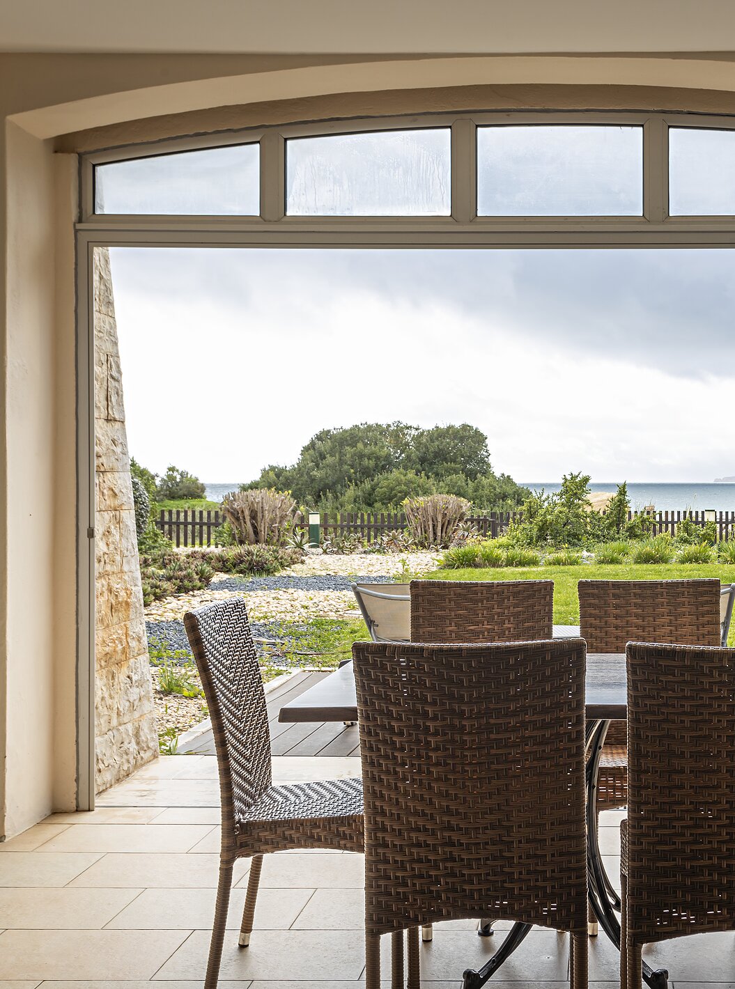 The Cliff Family at Pestana Alvor Praia has a porch with a table and chairs, and a garden with a view of the beach