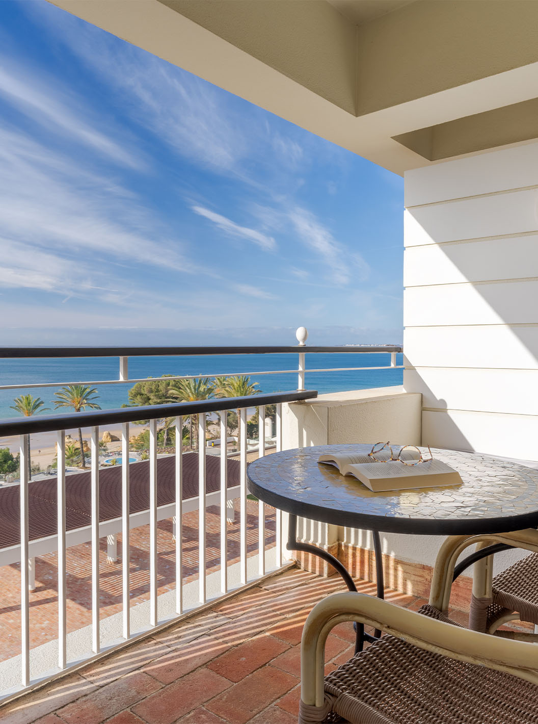 The Superior Sea View at Pestana Alvor Praia has a balcony with a table, chairs, and a sofa with sea views