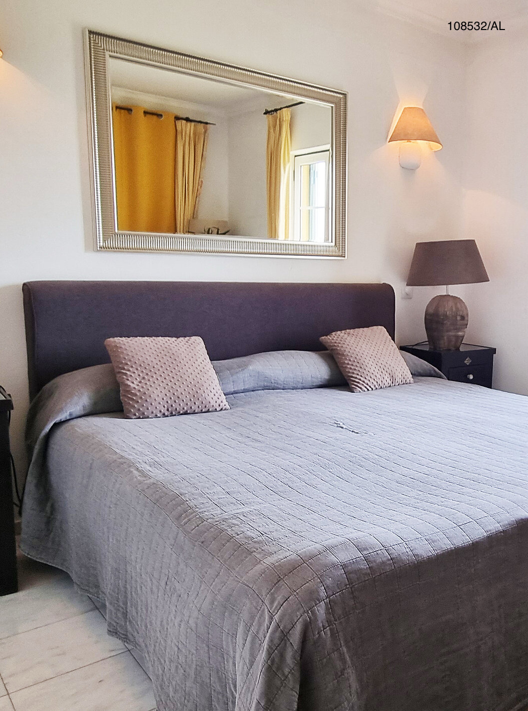 The Pestana Carvoeiro Golf T1 Superior Apartment has a double bed with two nightstands and a mirror