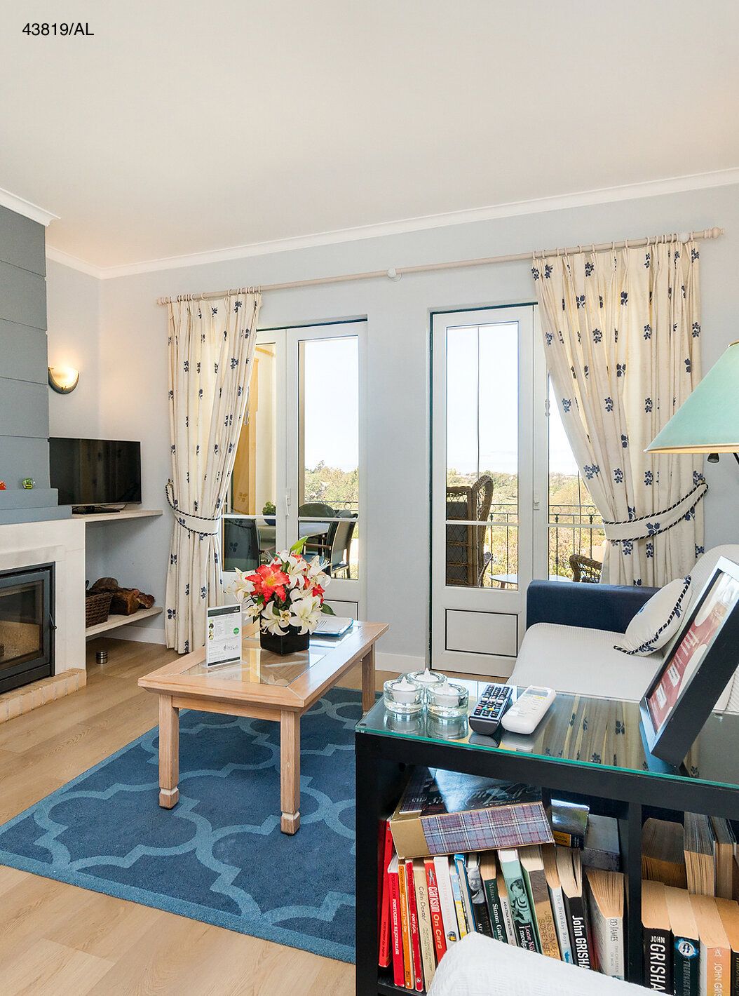 The Pestana Carvoeiro Golf T1 Superior Apartment has a living room with a fireplace, sofa, and side tables