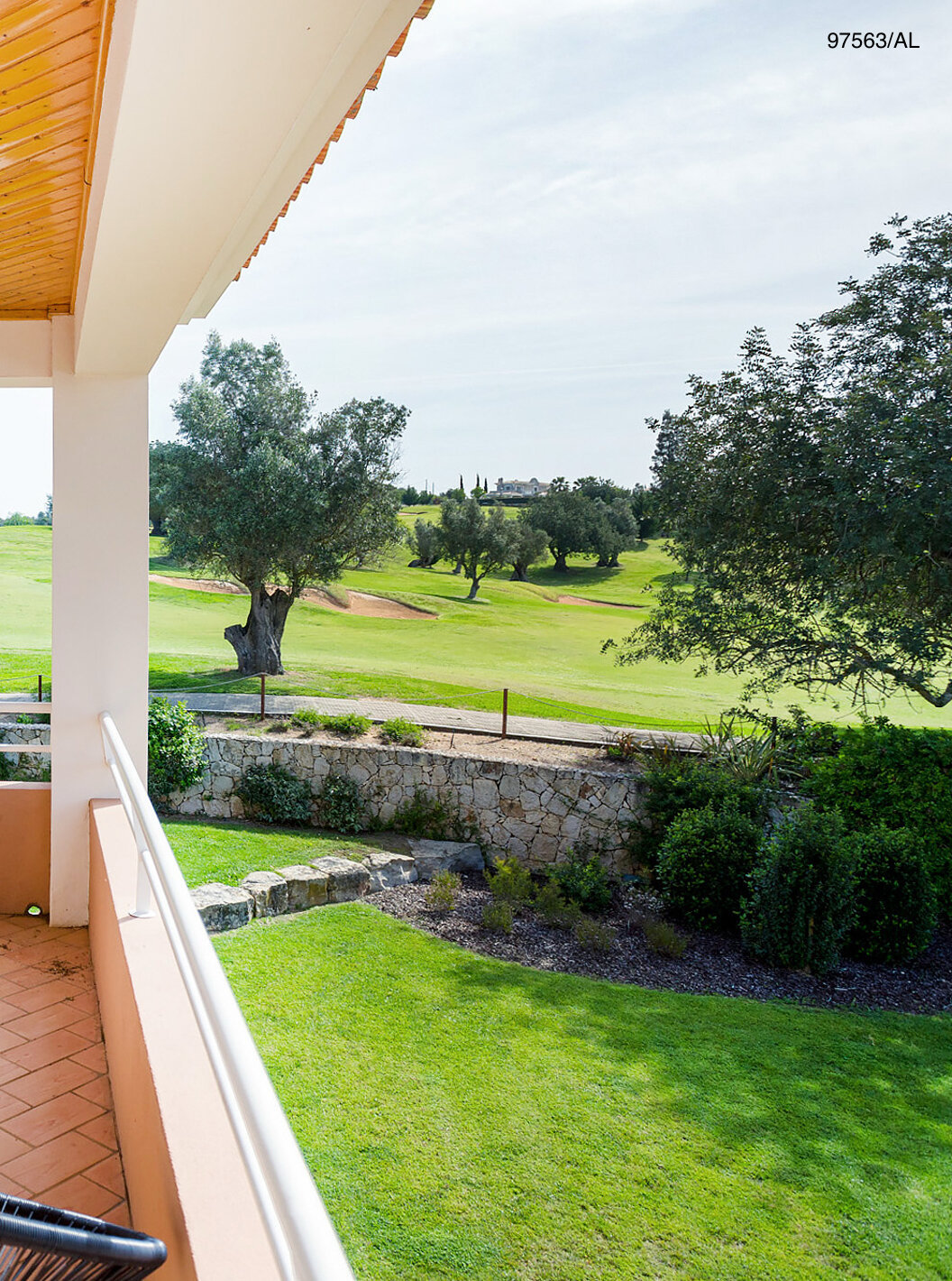 The Pestana Carvoeiro Golf T3 Superior Apartment has a balcony with tables and chairs, with garden views