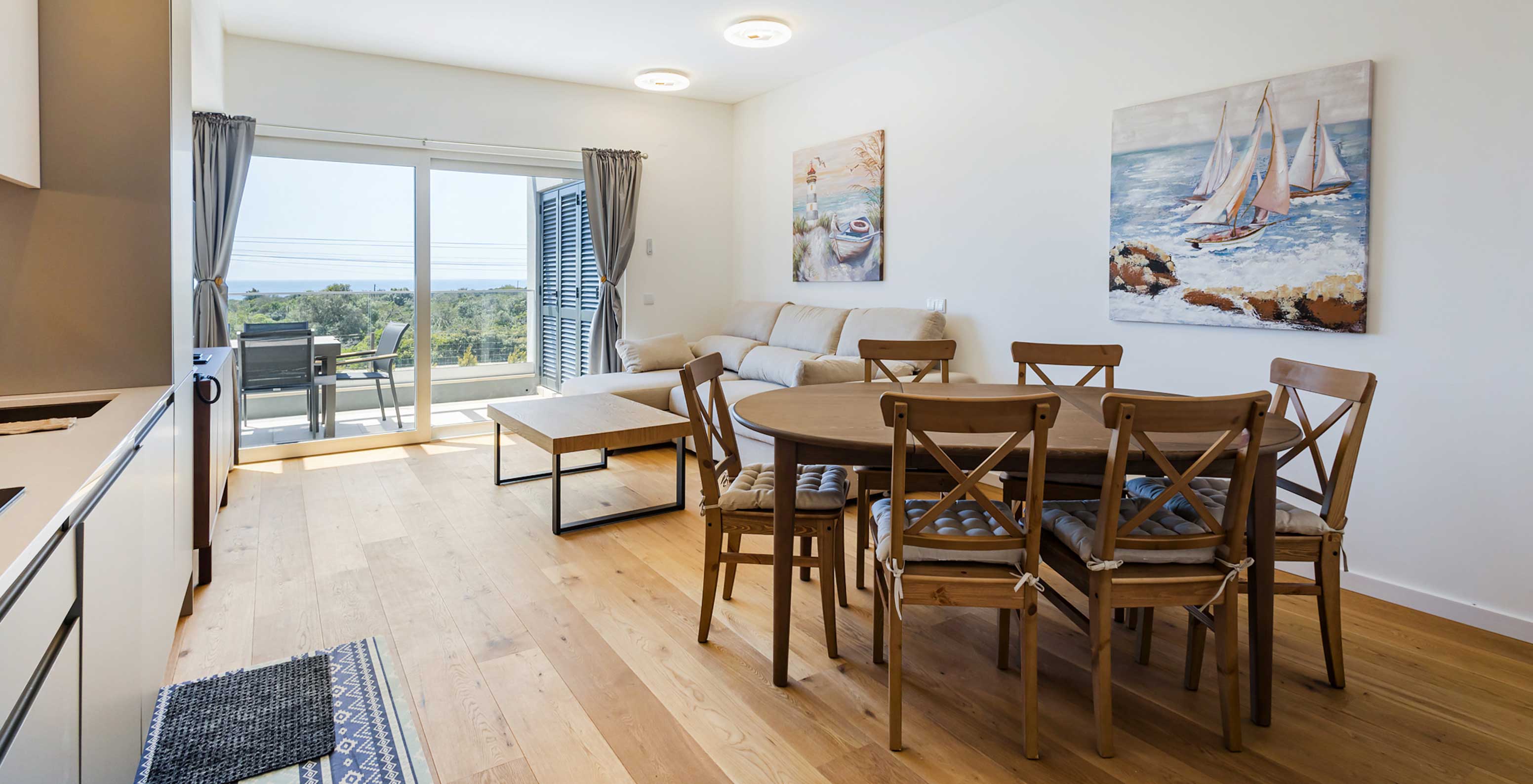 Pestana Valley Nature Village apartment with a dining table, a sofa, and a view