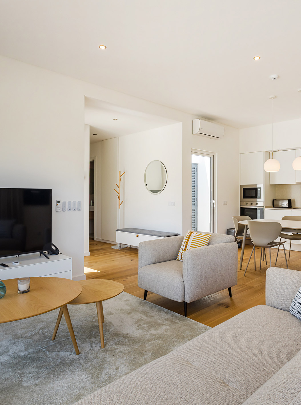 The Premium Villa 3 Bedroom - 6 Adults at Pestana Valley Nature Village has a dining table, a sofa, and a television