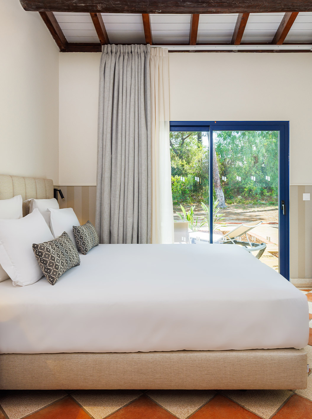 The Classic Garden room at Pestana Vila Sol - Vilamoura has a double bed, desk with chair, and a window with balcony