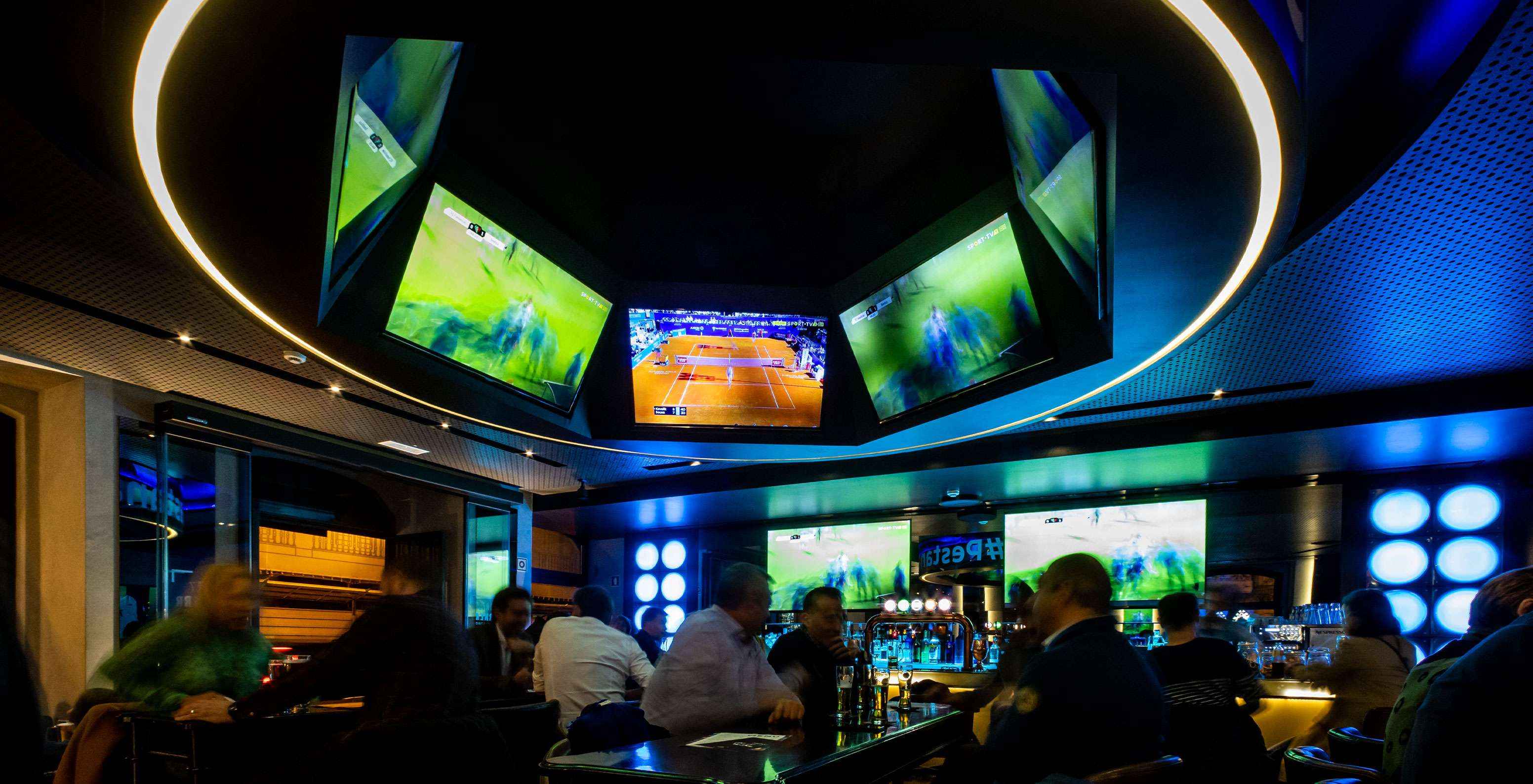 At the Corner bar in the historic center of Lisbon, you can watch sports, enjoy drinks, and have meals