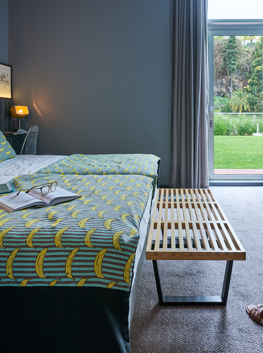 The CR7 Room at Pestana CR7 Funchal offers direct access to the hotel's upper garden through a glass door