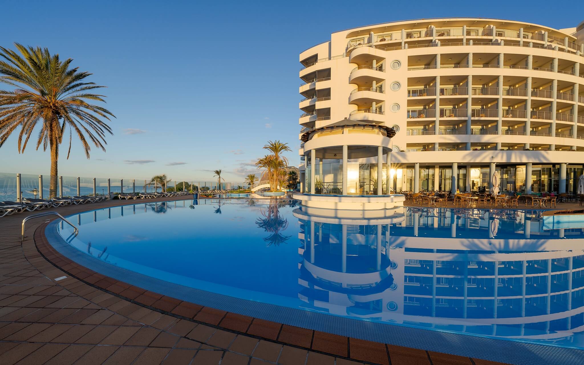 Exterior view of the Pestana Grand building, a 5-star hotel with a spa overlooking the sea, in Madeira