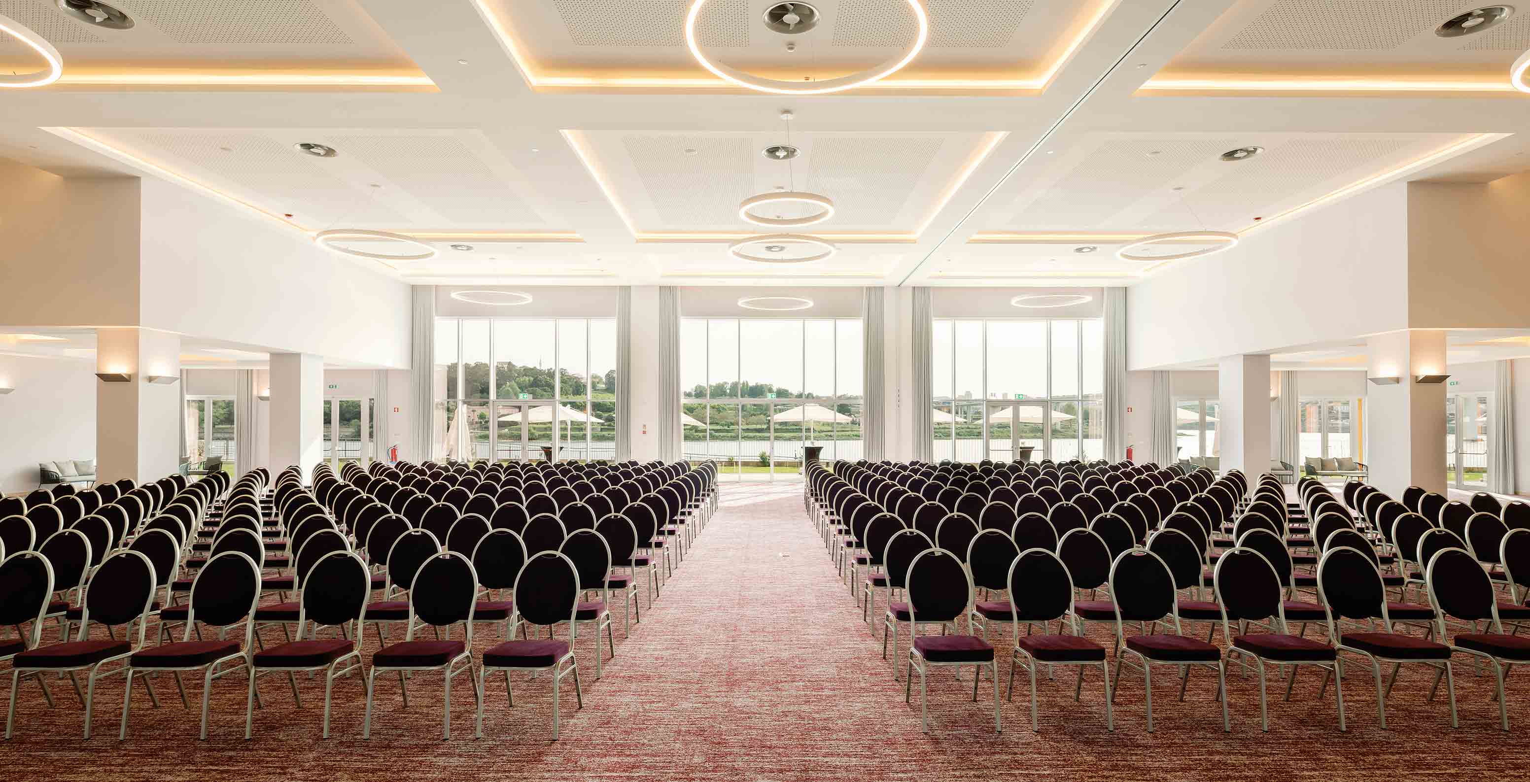 Ballroom with chairs and large windows at Pestana Douro Riverside Hotel with Pool by the Douro River