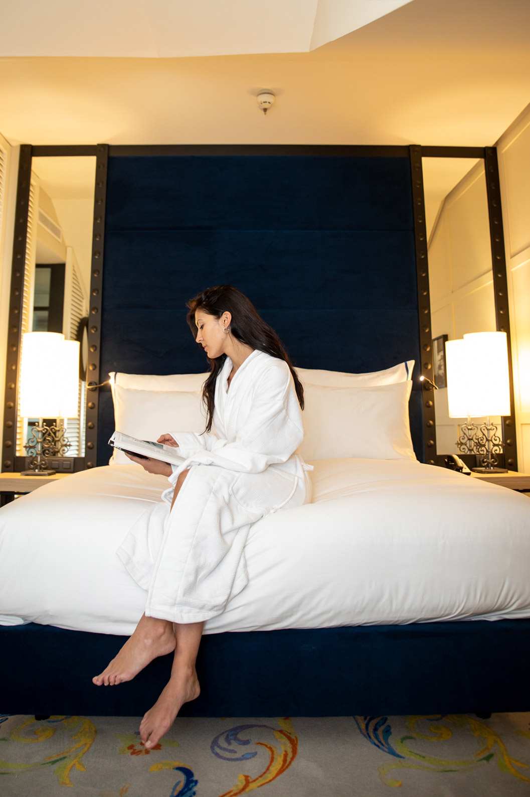 Superior Room at Pestana Collection Plaza Mayor has a bed with two bedside tables and two mirrors