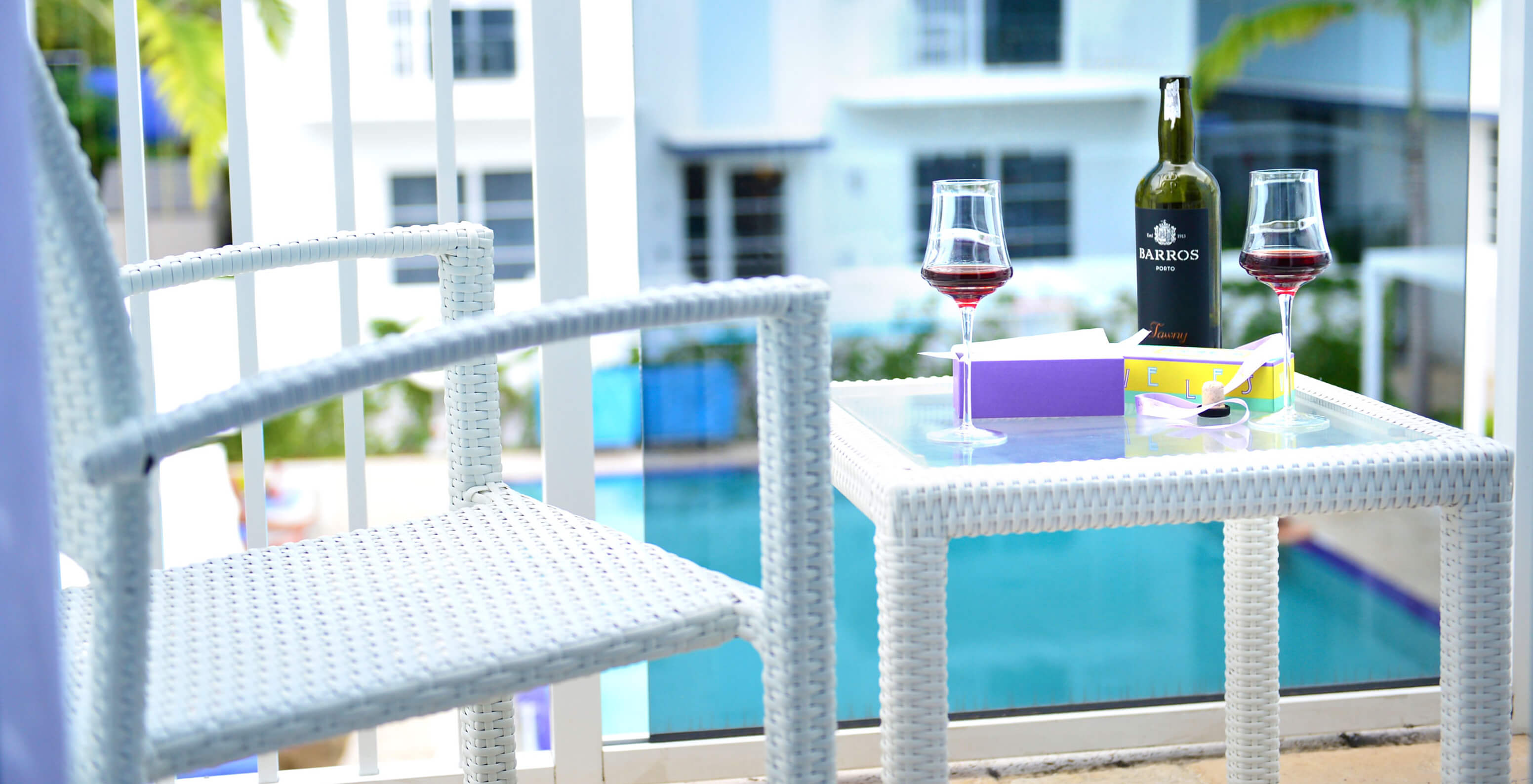 The Two Bedroom Suite with Balcony at Pestana Miami has a table and pool view.