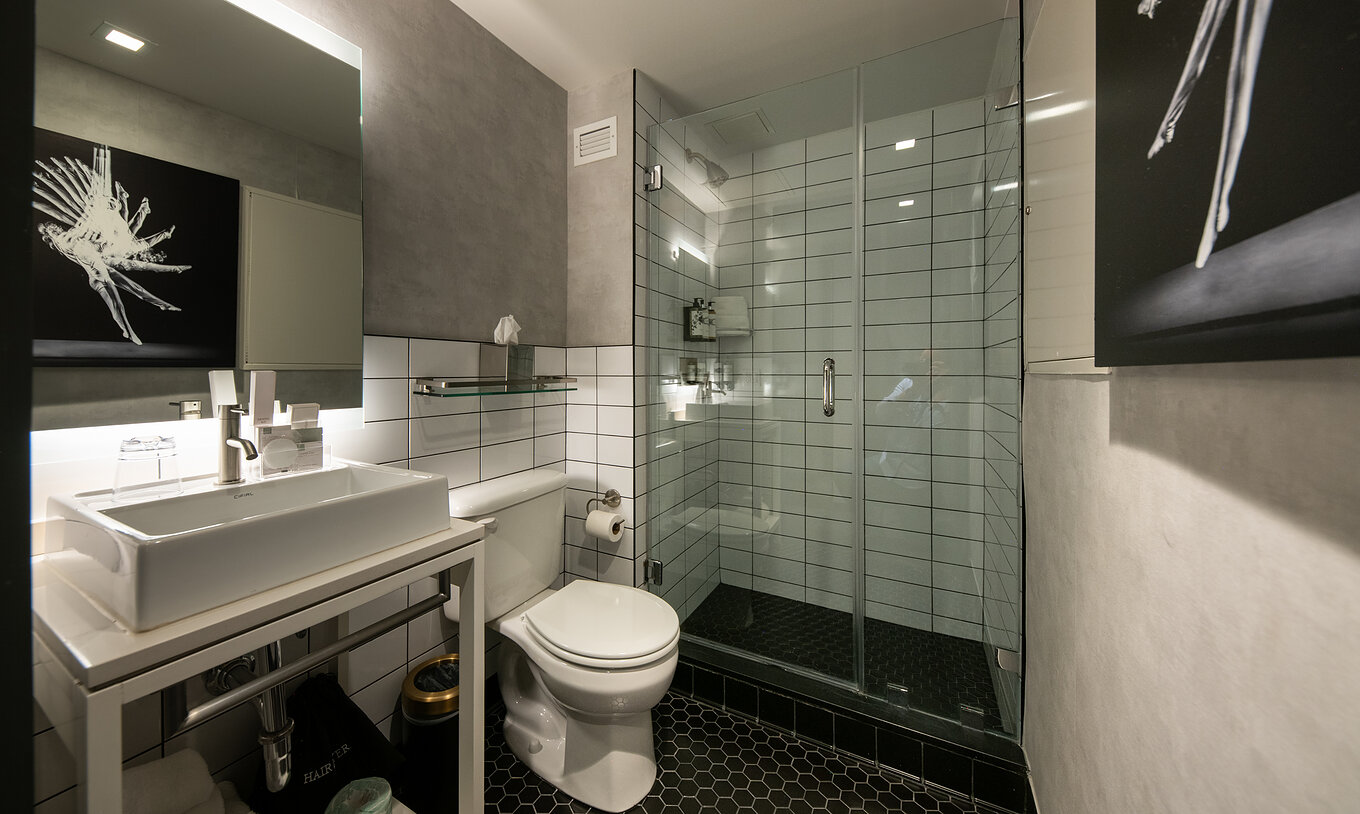 The Superior King High Floor at Pestana CR7 Times Square has a bathroom with sink, mirror, and shower