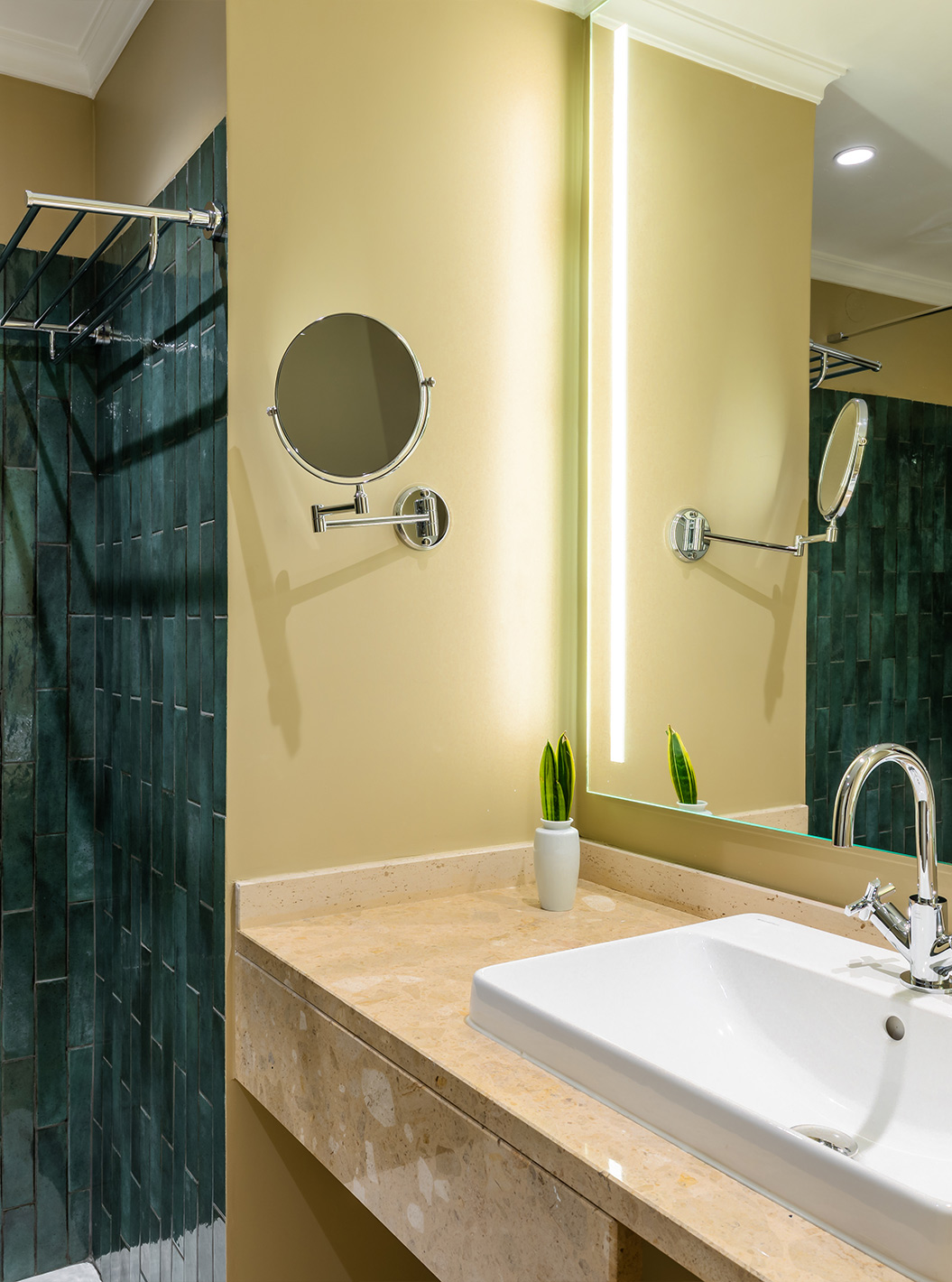 The Junior Suite Partial Sea View Room at Pestana Quinta Perestrello has a bathroom with a washbasin and tiles.