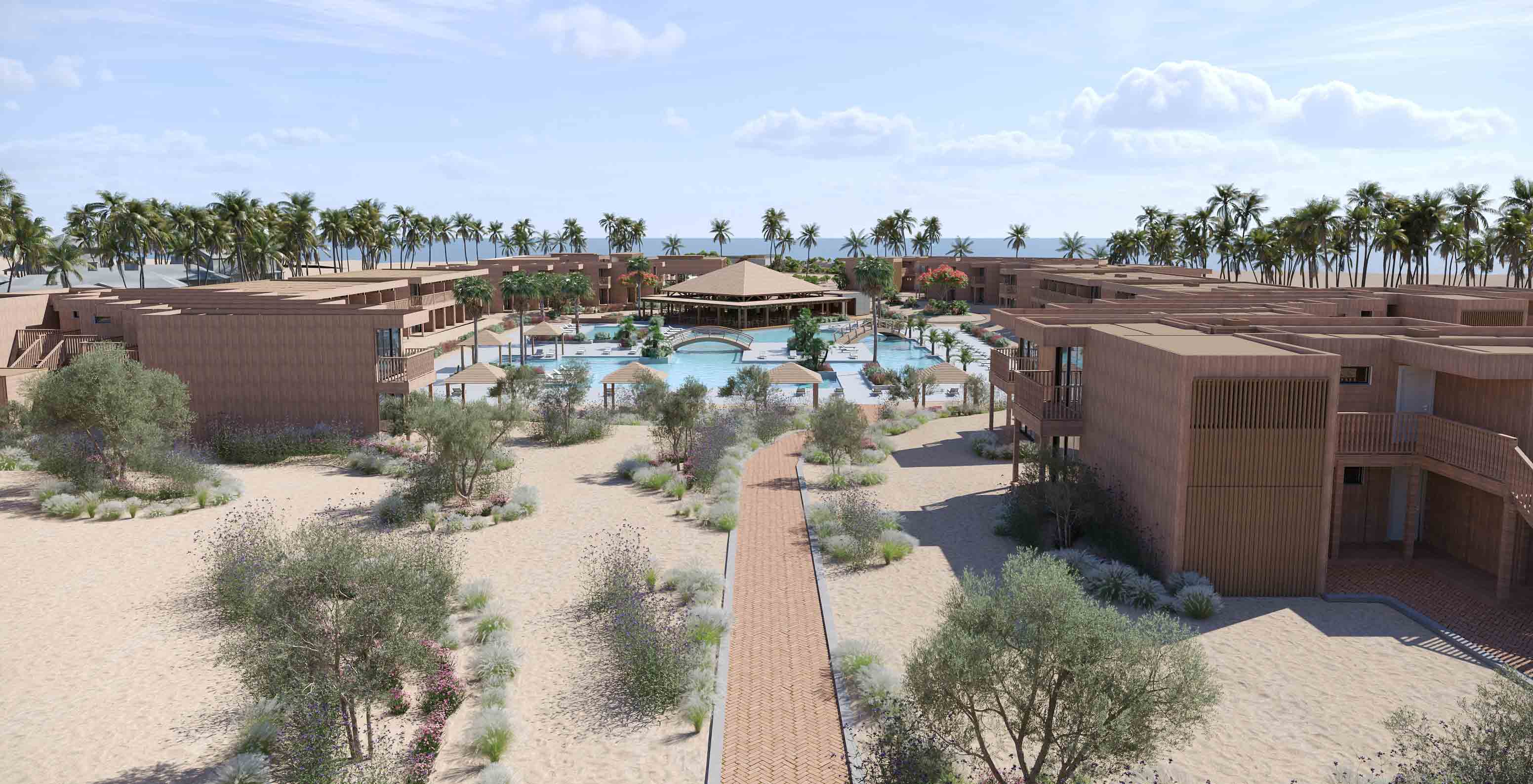 Vista aérea do Pestana Dunas Porto Santo, com piscina central rodeada por edifícios e palmeiras junto à praia