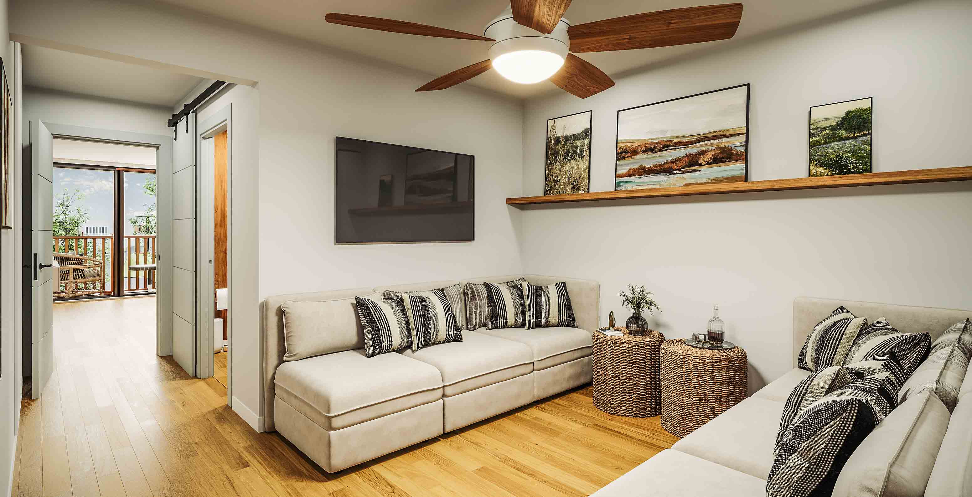 Sala da suite do Pestana Dunas Porto Santo com sofás bege, almofadas listradas e varanda ao fundo