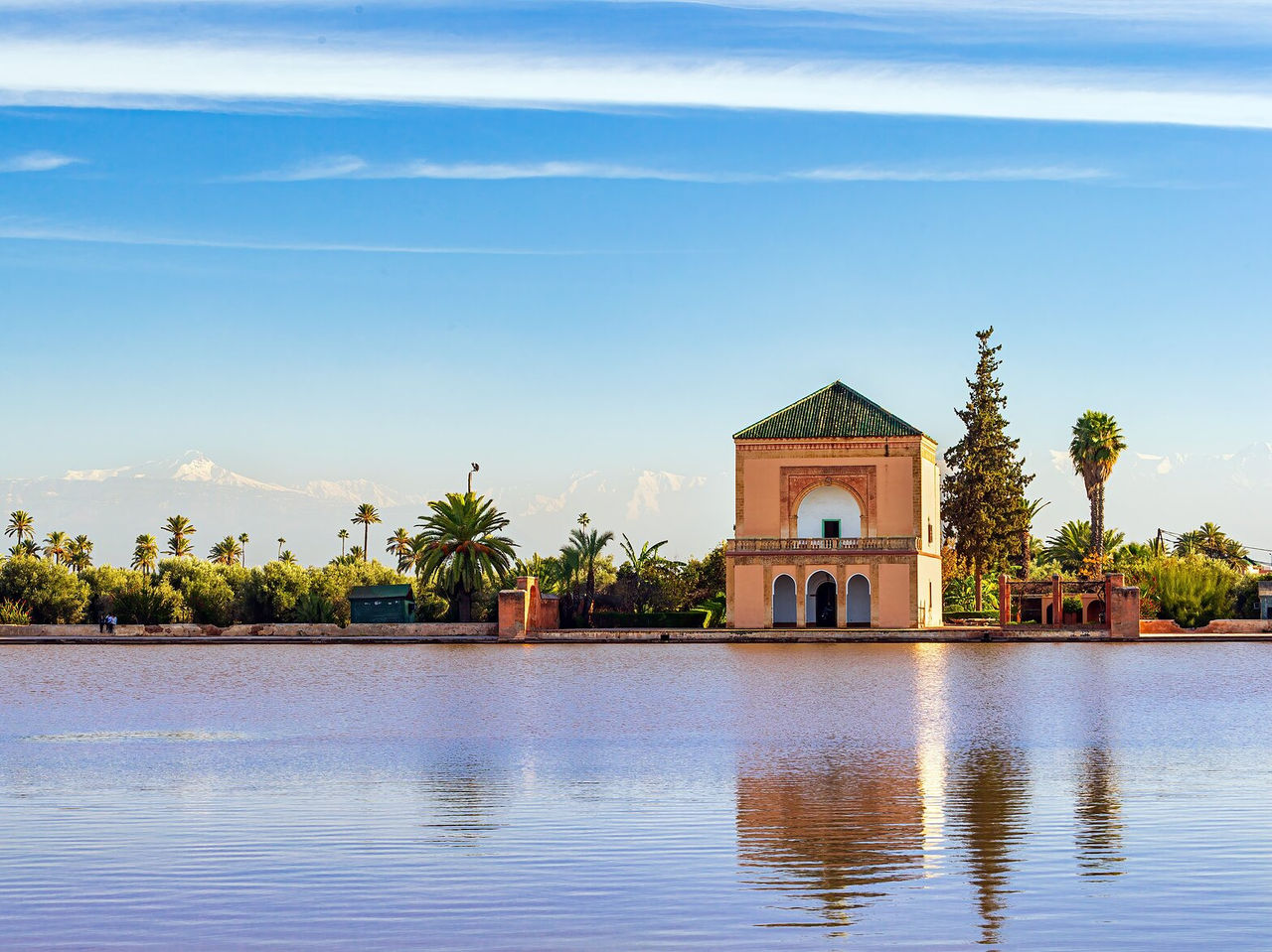 In Marrakech, visit one of the main gardens, Menara Gardens, and be amazed by the lake and pavilion in the midst of nature