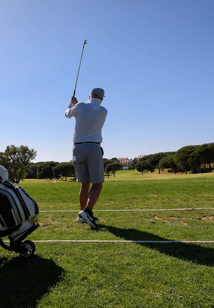 Man taking a shot on the golf course at Pestana Vila Sol - Vilamoura, Hotel with Golf and Spa in Algarve