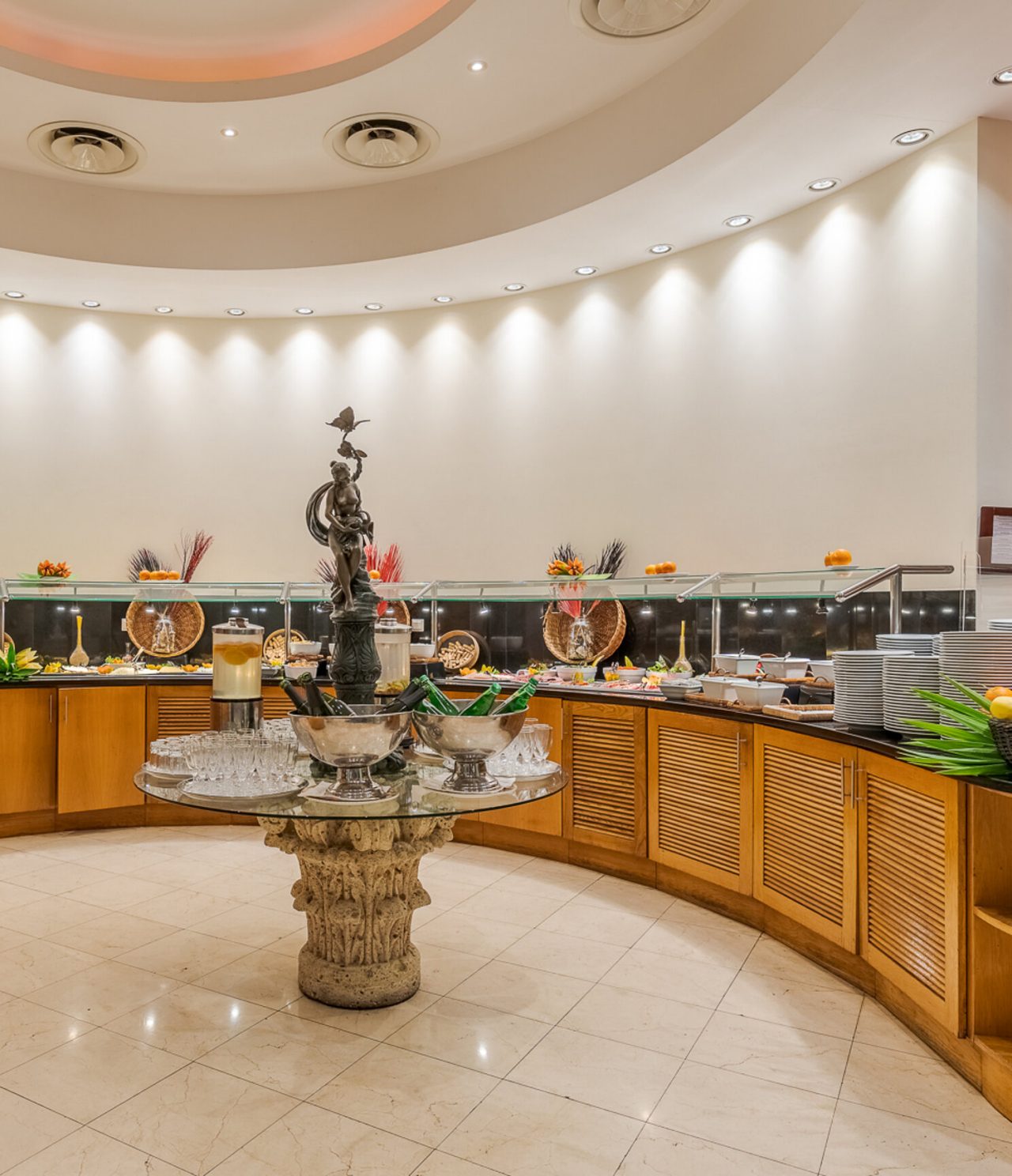 The Restaurant Atrium at a 5-star Funchal hotel has a buffet area with various foods