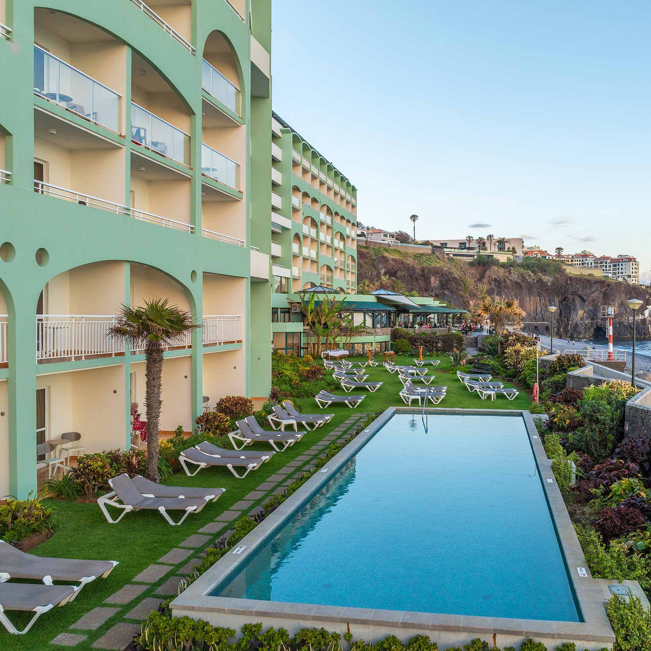 Exterior facade of Pestana Ocean Bay All Inclusive, a 5-star hotel in Funchal, Madeira, with pool