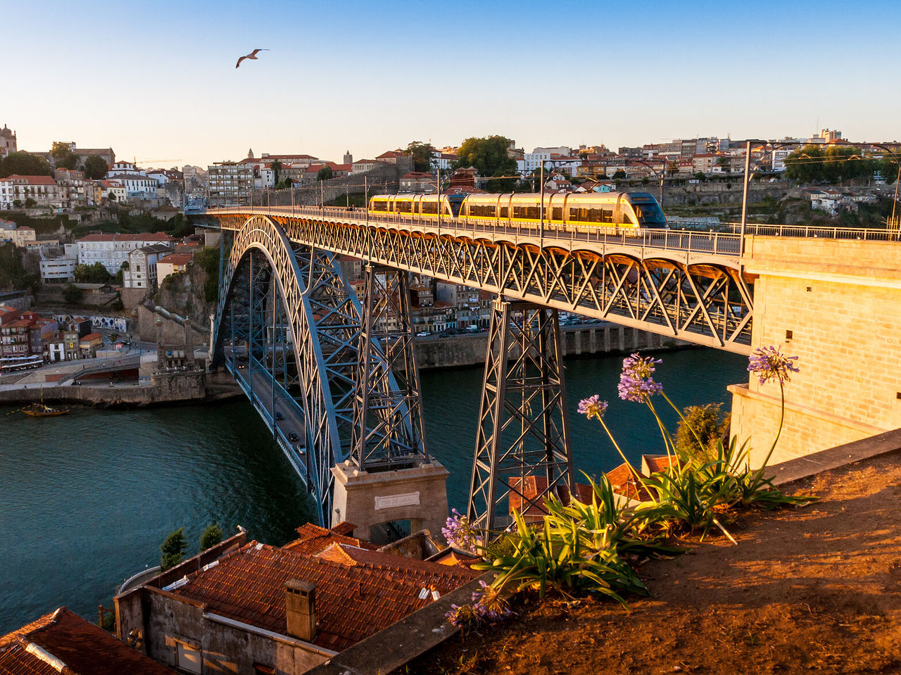 View of the Dom Luis I Bridge, an icon of Porto, with the Douro River and historic buildings
