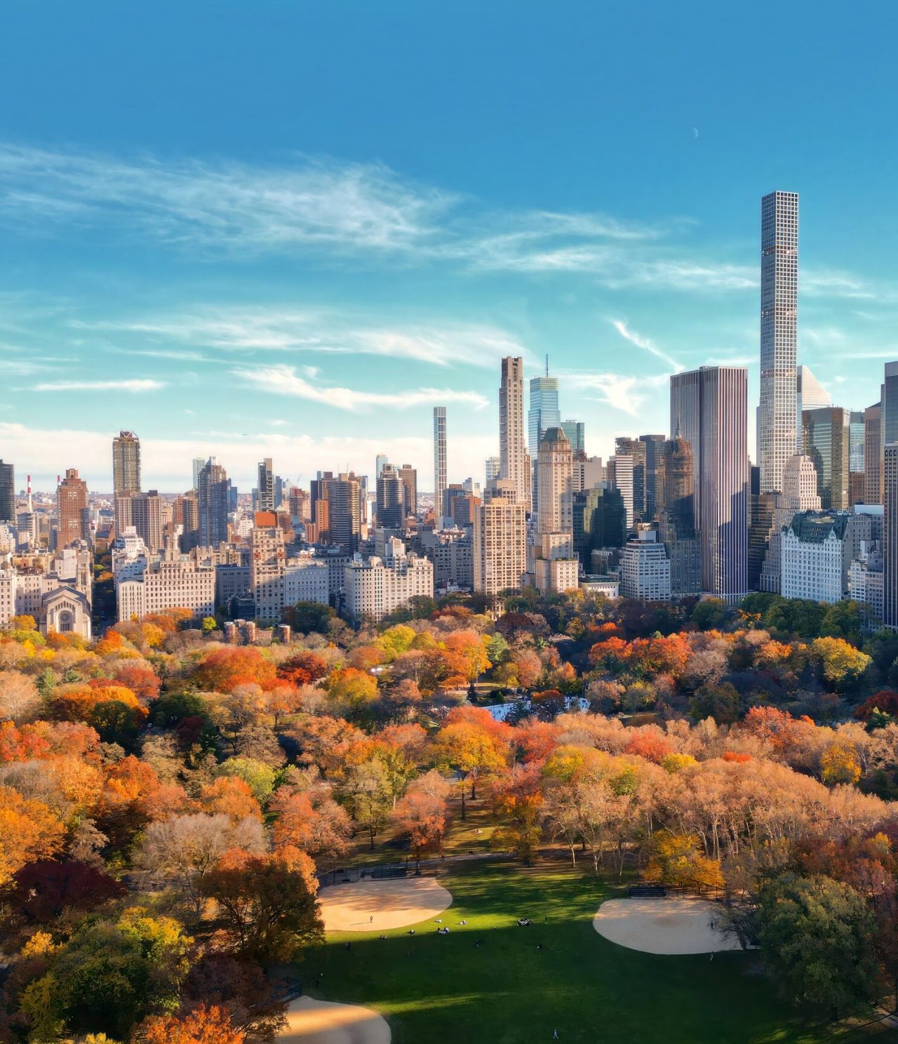Panoramic view of Central Park in New York during autumn, with trees in their vibrant seasonal colors